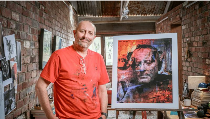 MSWA Client, Hank Gidney standing next to his artwork.