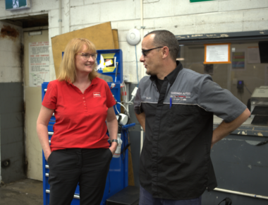 mswa and client speaking in a mechanic workshop