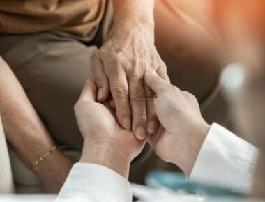 Stock image of holding hands.