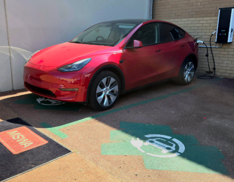 Electric car charging at station