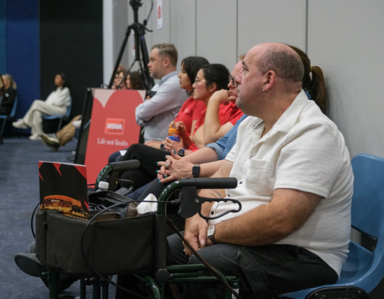 Event attendees engaging in the Client and Community Forum.