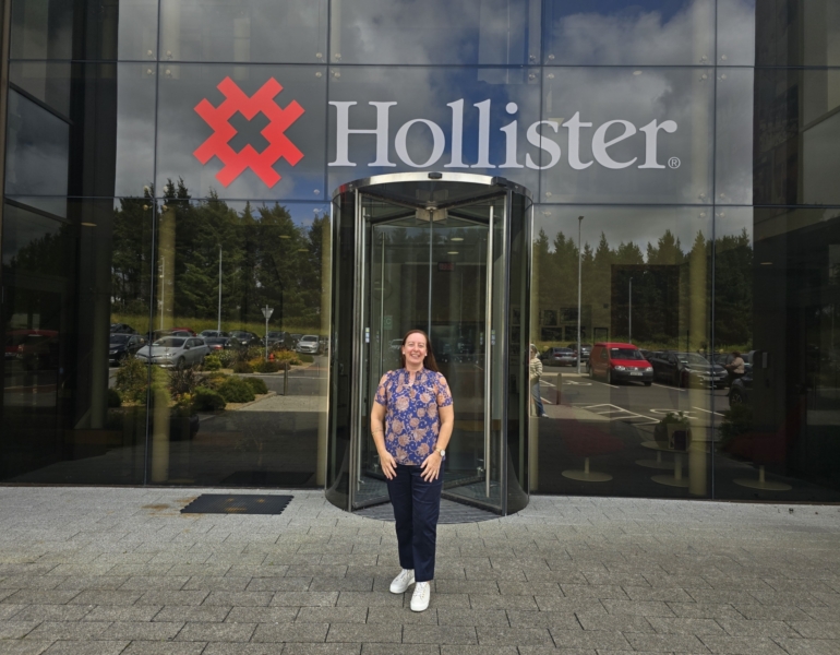 Dee in front of the Hollister factory