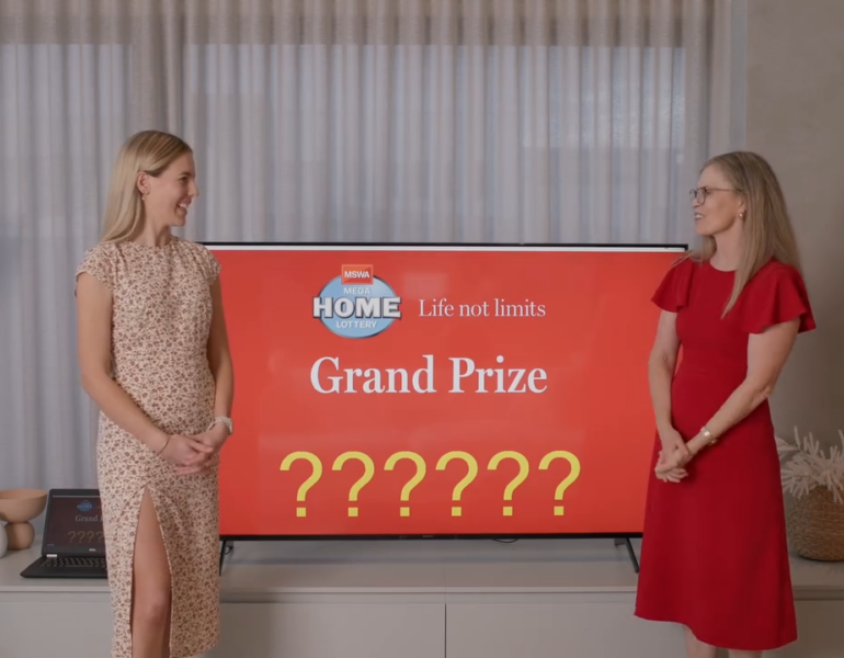 MSWA Client Sophie with CEO at MHL grand prize winner reveal