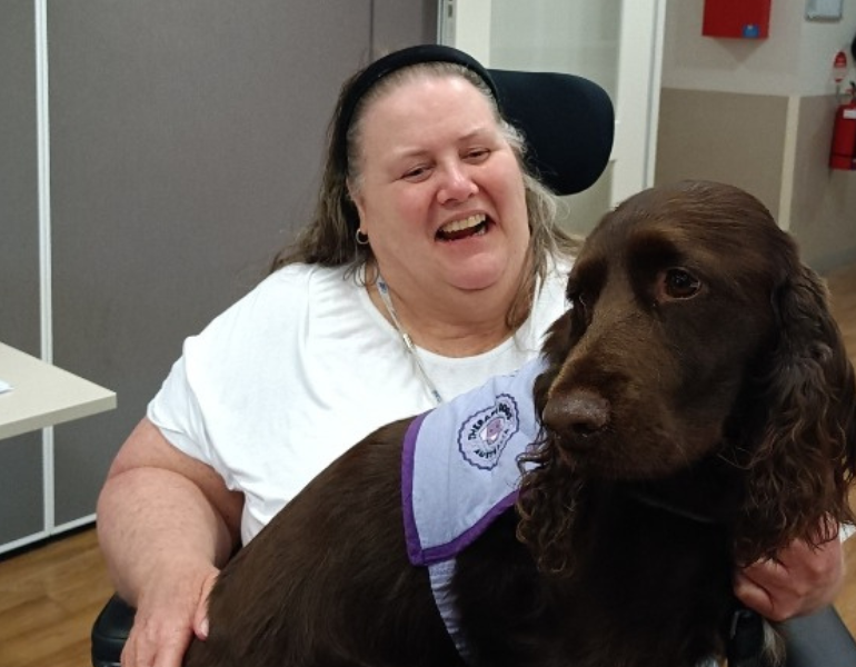 Woman and dog at Bunbury outreach