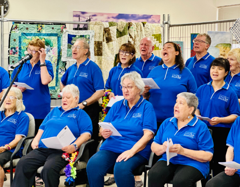 Group of people singing together.