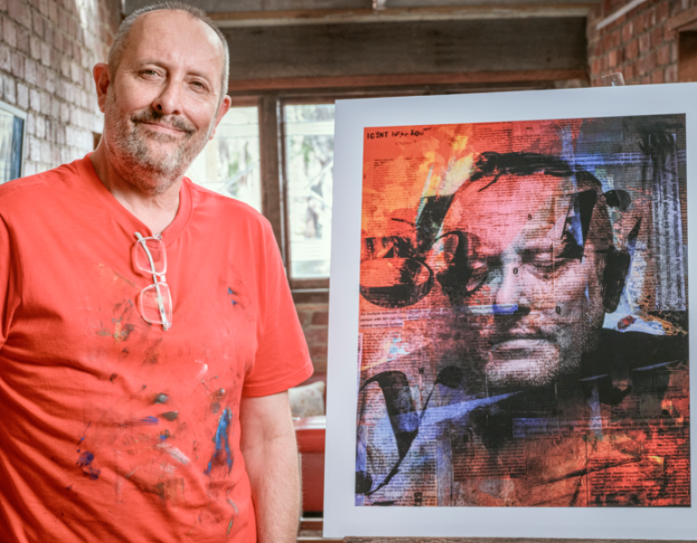 Hank posing with his artwork