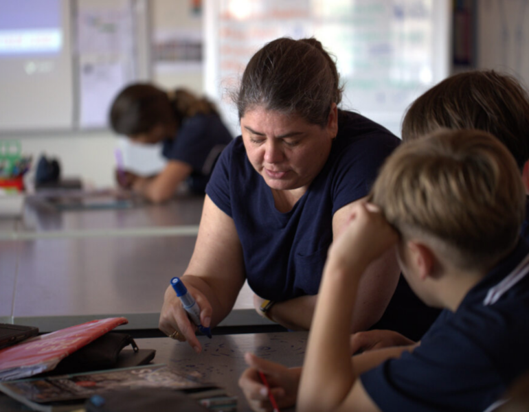 Woman in school setting with children