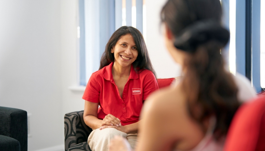 client and counsellor sitting on armchairs during a session