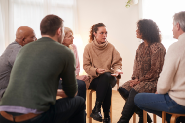 group of adults talking among each other