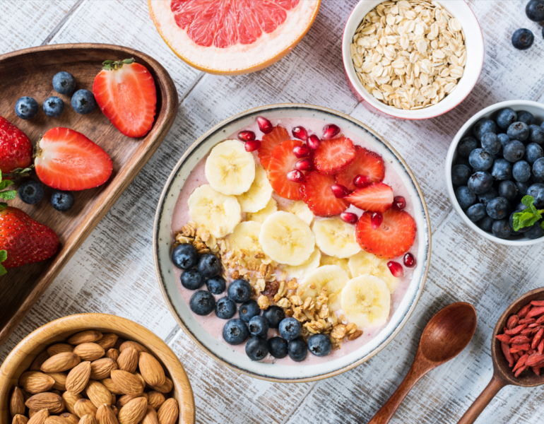 breakfast bowl with bananas, strawberries and blueberries