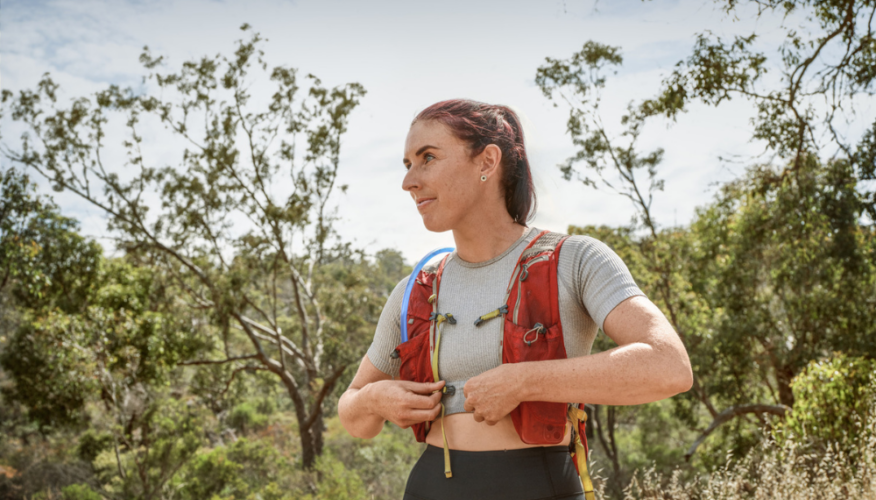 holly clipping her cooling vest before running