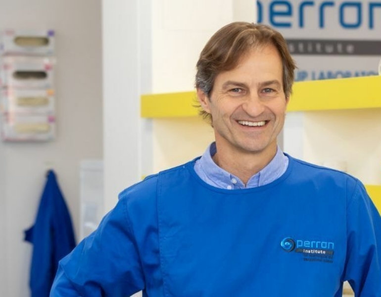 man smiling at the camera
