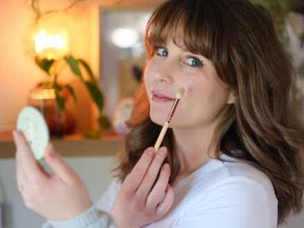 woman applying makeup