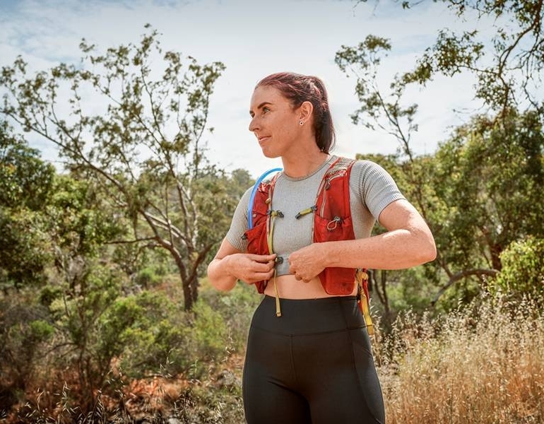 woman clipping cooling vest