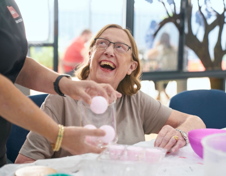woman smiling and playing games
