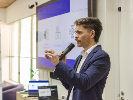 Man speaking into a microphone.