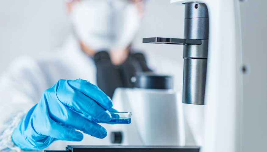 researcher using microscope