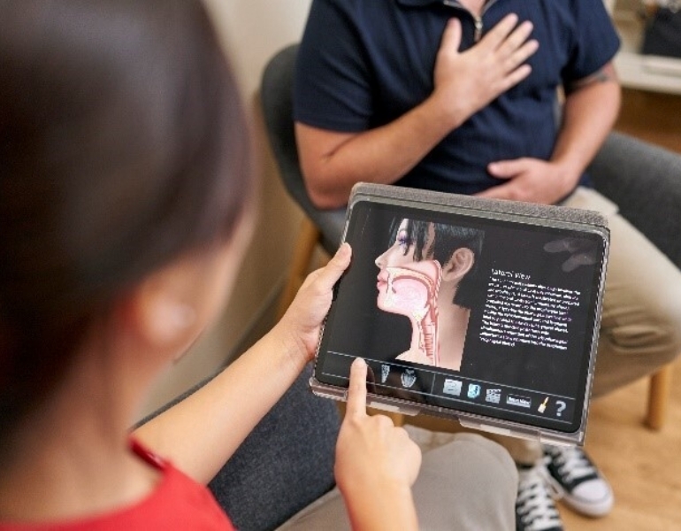Speech therapist with client