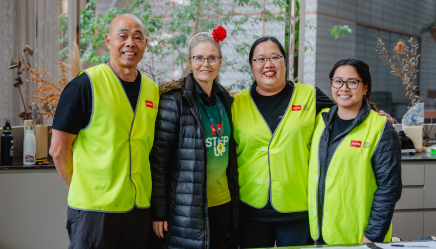 group of volunteers smiling at the camera