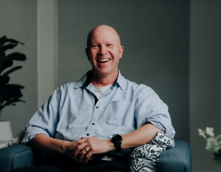 man smiling at the camera